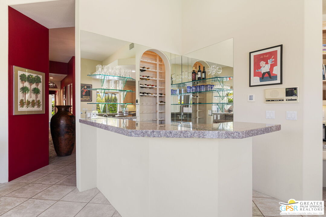 36630 Palm Court Rancho Mirage, CA 92270 - Photo 27 of 46 a view of a kitchen with stainless steel appliances granite countertop a refrigerator and a counter top space