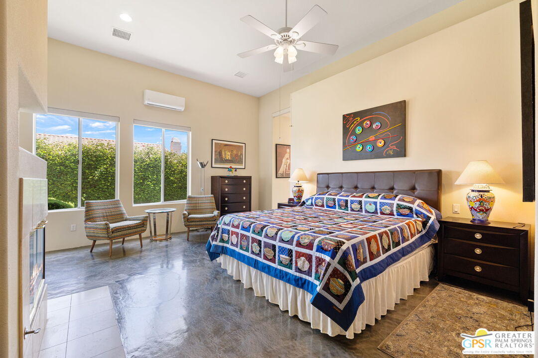 36630 Palm Court Rancho Mirage, CA 92270 - Photo 29 of 46 a bedroom with a bed and a large window