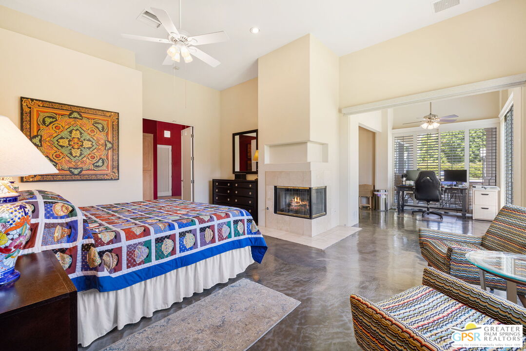 36630 Palm Court Rancho Mirage, CA 92270 - Photo 30 of 46 a bedroom with a bed and wooden floor