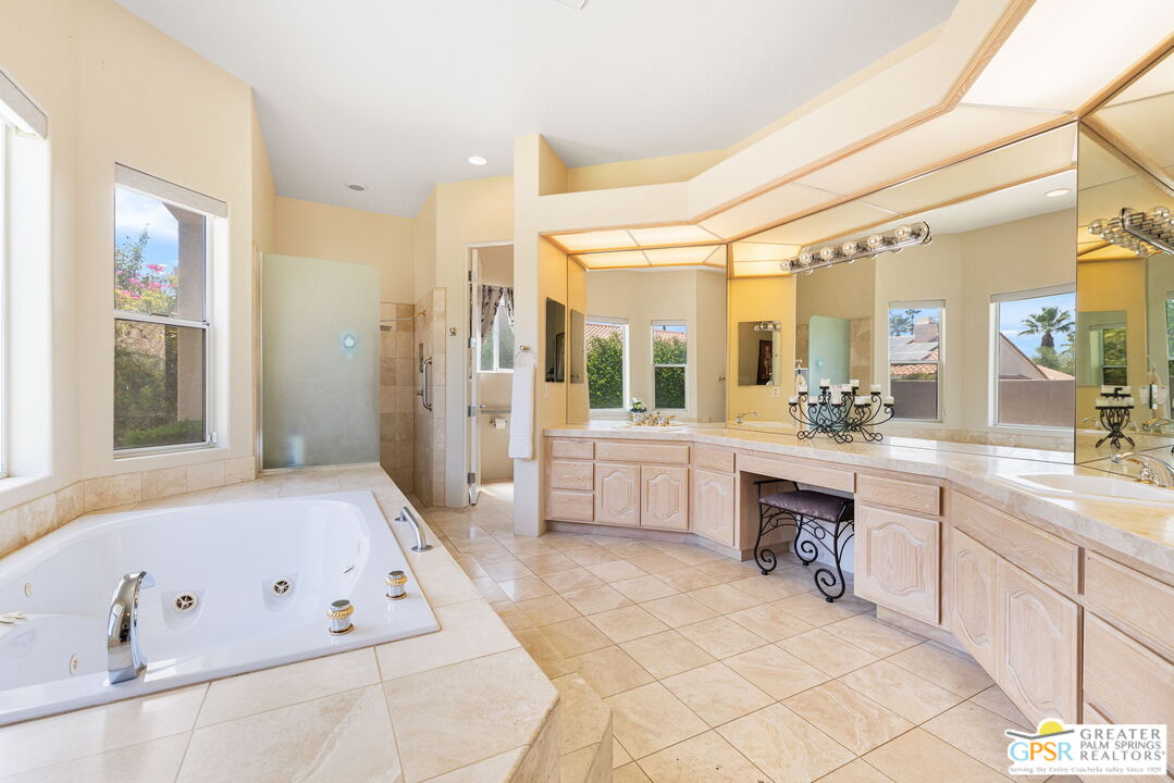 36630 Palm Court Rancho Mirage, CA 92270 - Photo 34 of 46 a large bathroom with a large tub shower and sink