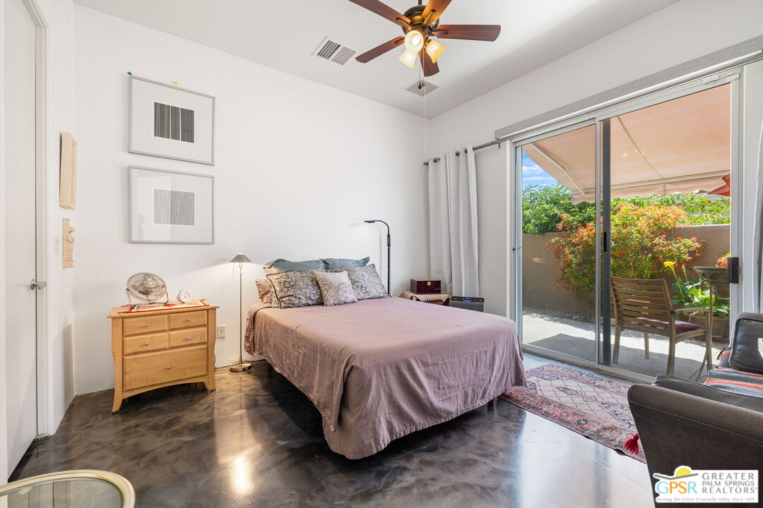 36630 Palm Court Rancho Mirage, CA 92270 - Photo 39 of 46 a bedroom with a bed couch and window