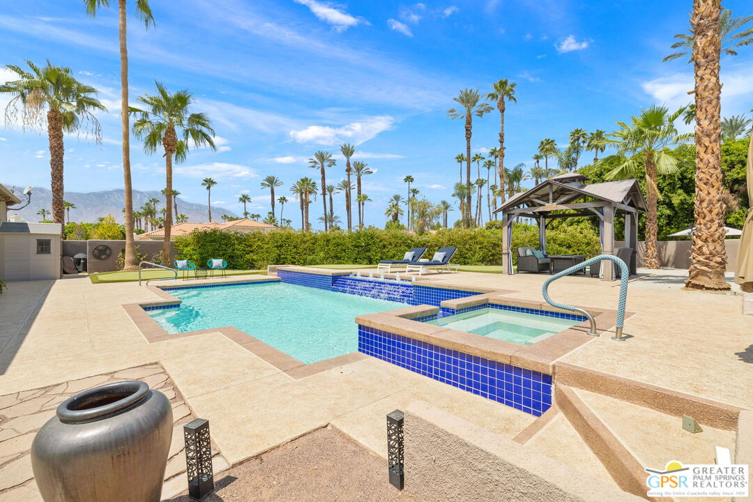 36630 Palm Court Rancho Mirage, CA 92270 - Photo 4 of 46 a view of a swimming pool with a patio