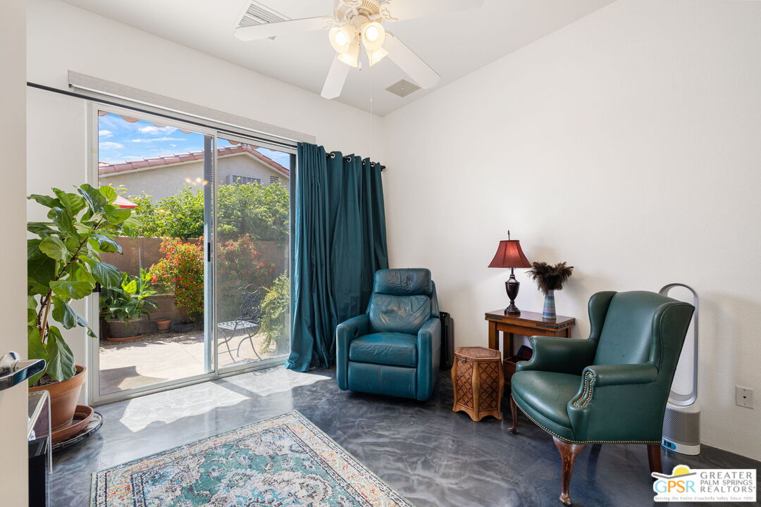 36630 Palm Court Rancho Mirage, CA 92270 - Photo 42 of 46 a living room with furniture and a large window