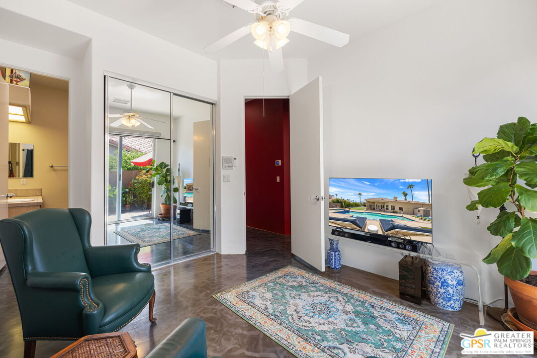 36630 Palm Court Rancho Mirage, CA 92270 - Photo 43 of 46 a living room with furniture and a potted plant