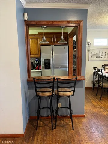 a kitchen with a sink appliances and cabinets