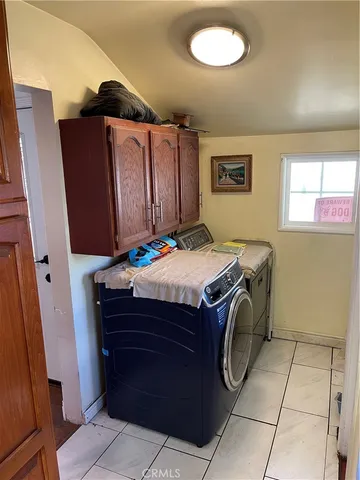 a kitchen with stainless steel appliances granite countertop a refrigerator and a stove