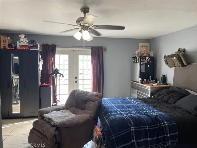 a bed room with a bed and a chandelier