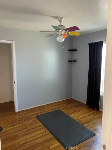a backyard of a house with barbeque oven table and chairs