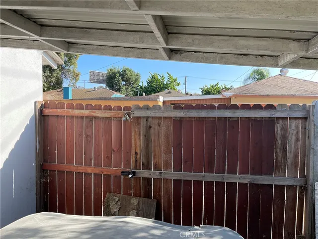 a view of a house with backyard and porch