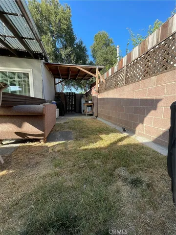 a view of a backyard of the house