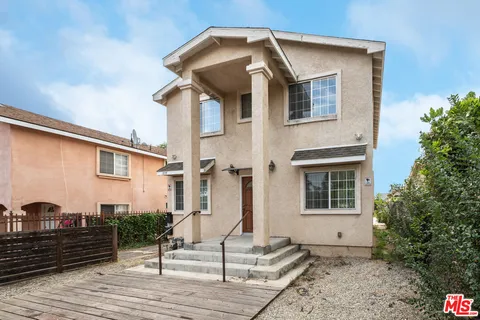 a front view of a house with stairs