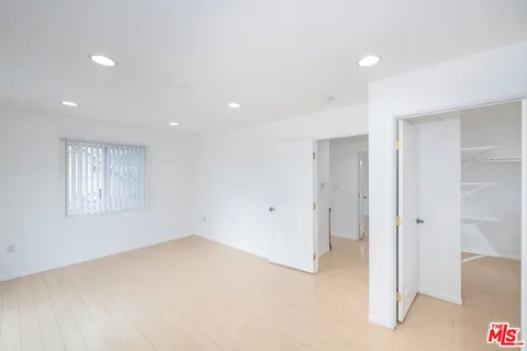 a view of staircase with white walls