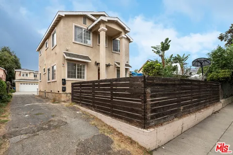 a front view of a house with garage