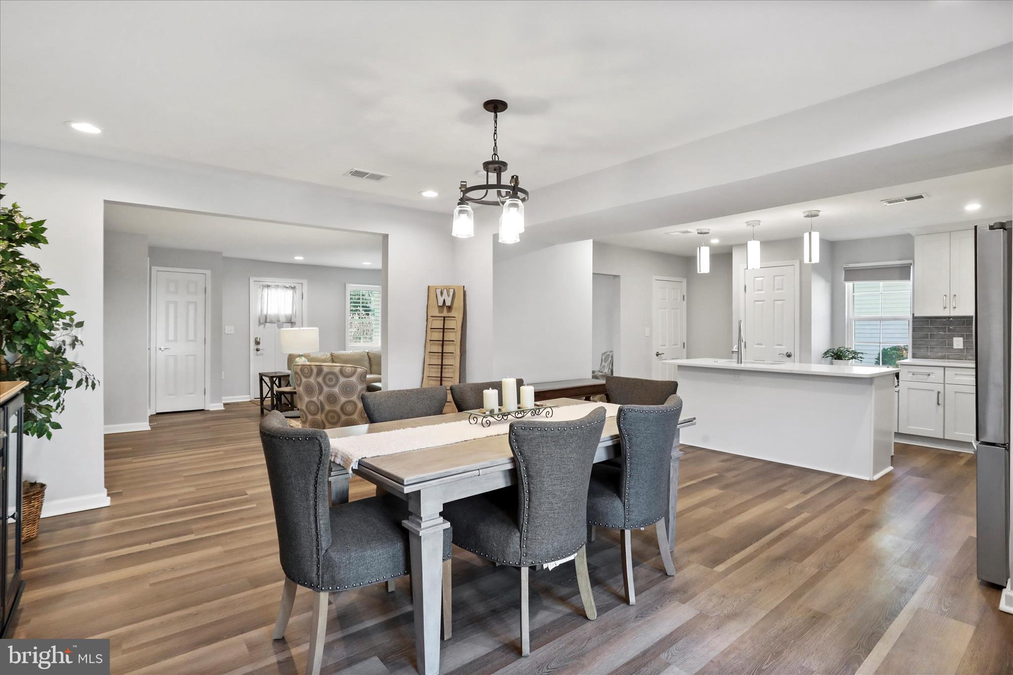 408 Blue Ridge Avenue Northeast Leesburg, VA 20176 - Photo 16 of 36 a view of a dining room with furniture and wooden floor