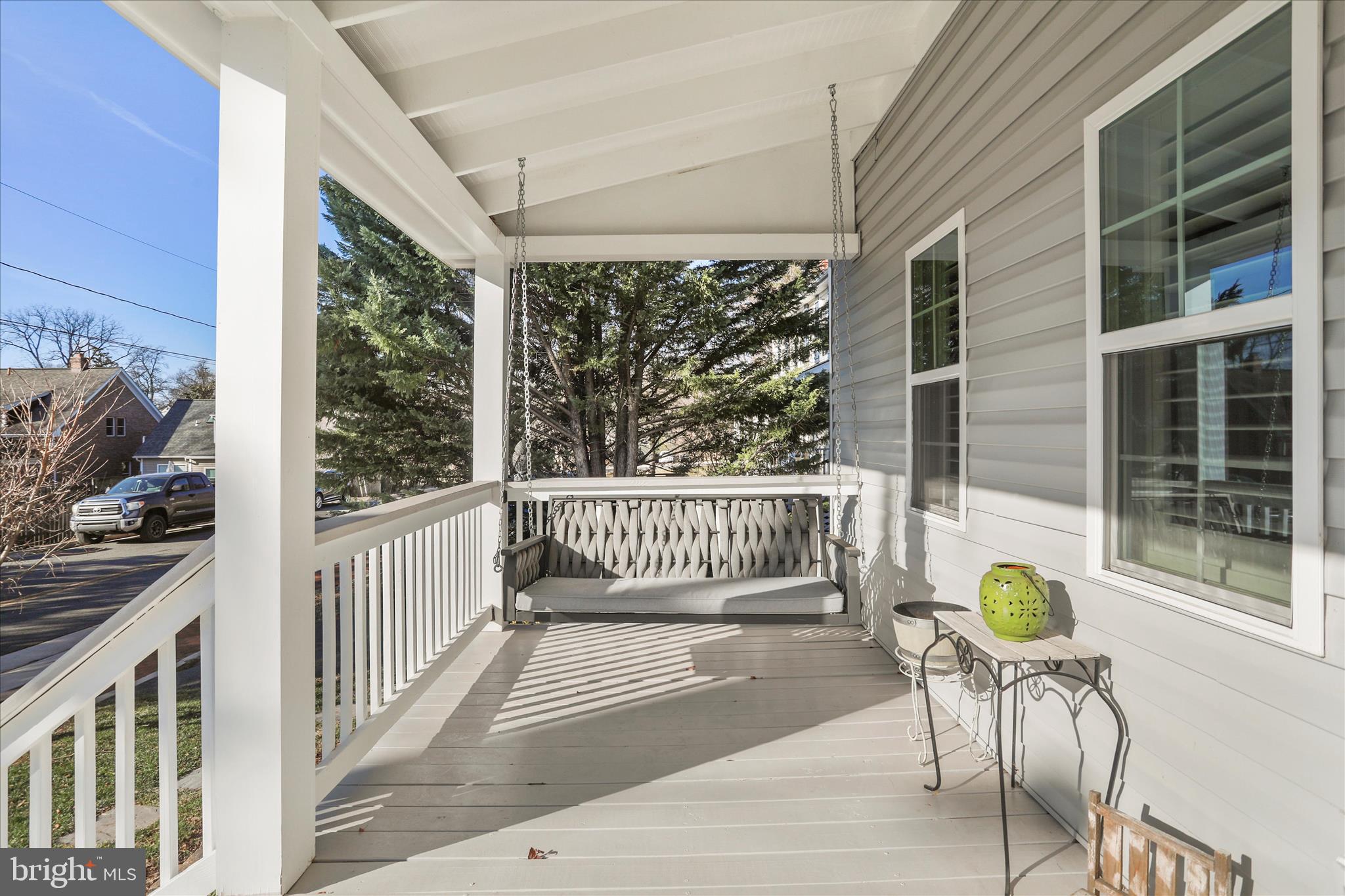 408 Blue Ridge Avenue Northeast Leesburg, VA 20176 - Photo 2 of 36 a view of a chair and table in the balcony