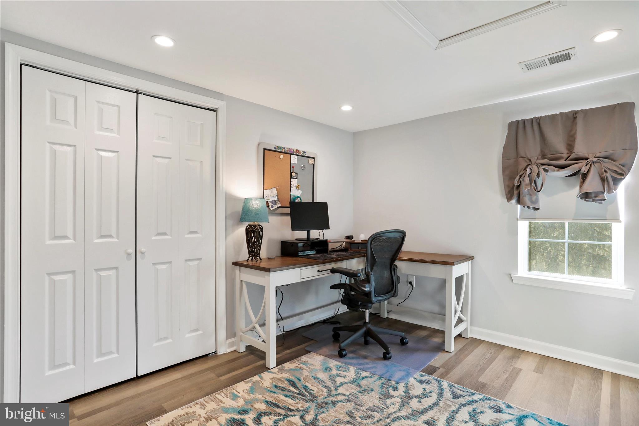 408 Blue Ridge Avenue Northeast Leesburg, VA 20176 - Photo 34 of 36 a workspace with wooden floor and a cabinet