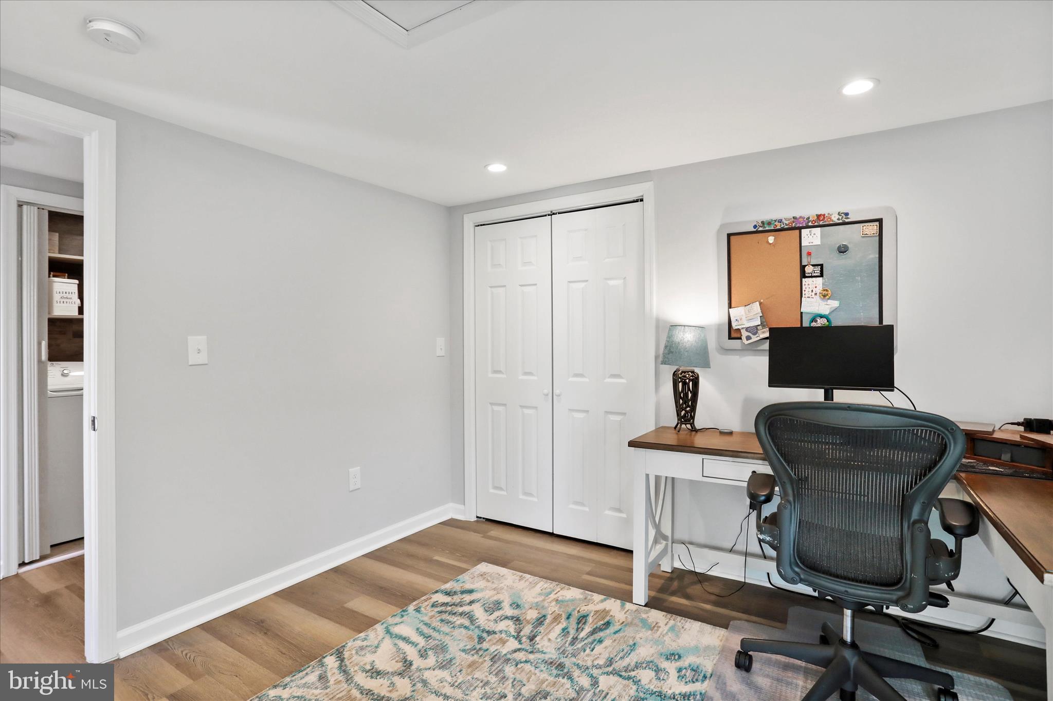 408 Blue Ridge Avenue Northeast Leesburg, VA 20176 - Photo 35 of 36 a workspace with furniture and wooden floor
