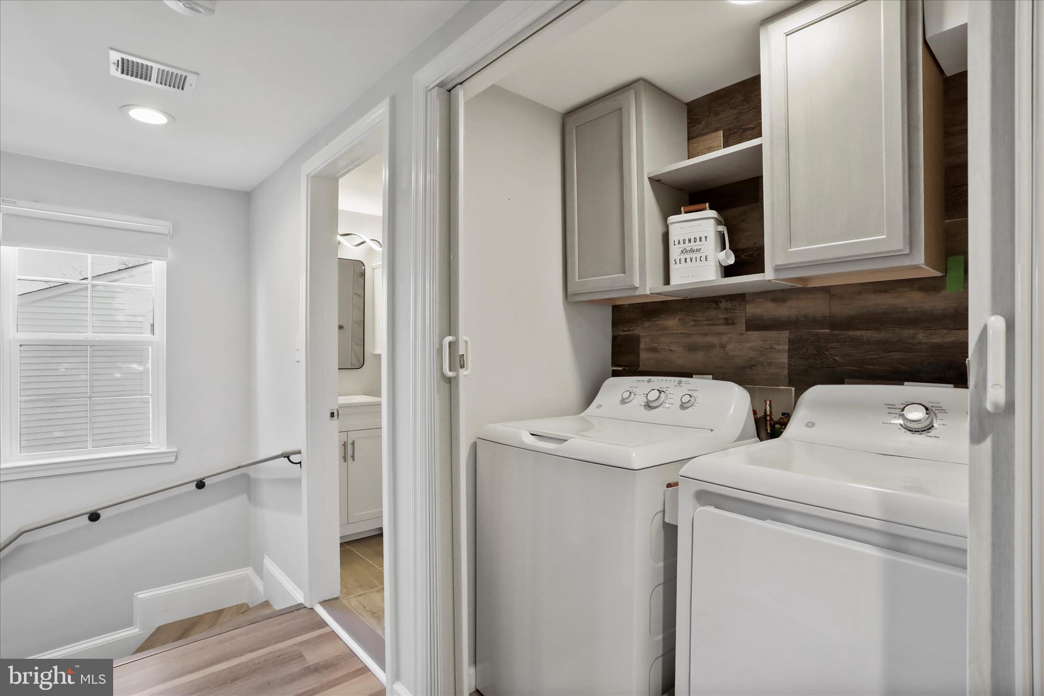 408 Blue Ridge Avenue Northeast Leesburg, VA 20176 - Photo 36 of 36 a bathroom with a toilet sink and mirror