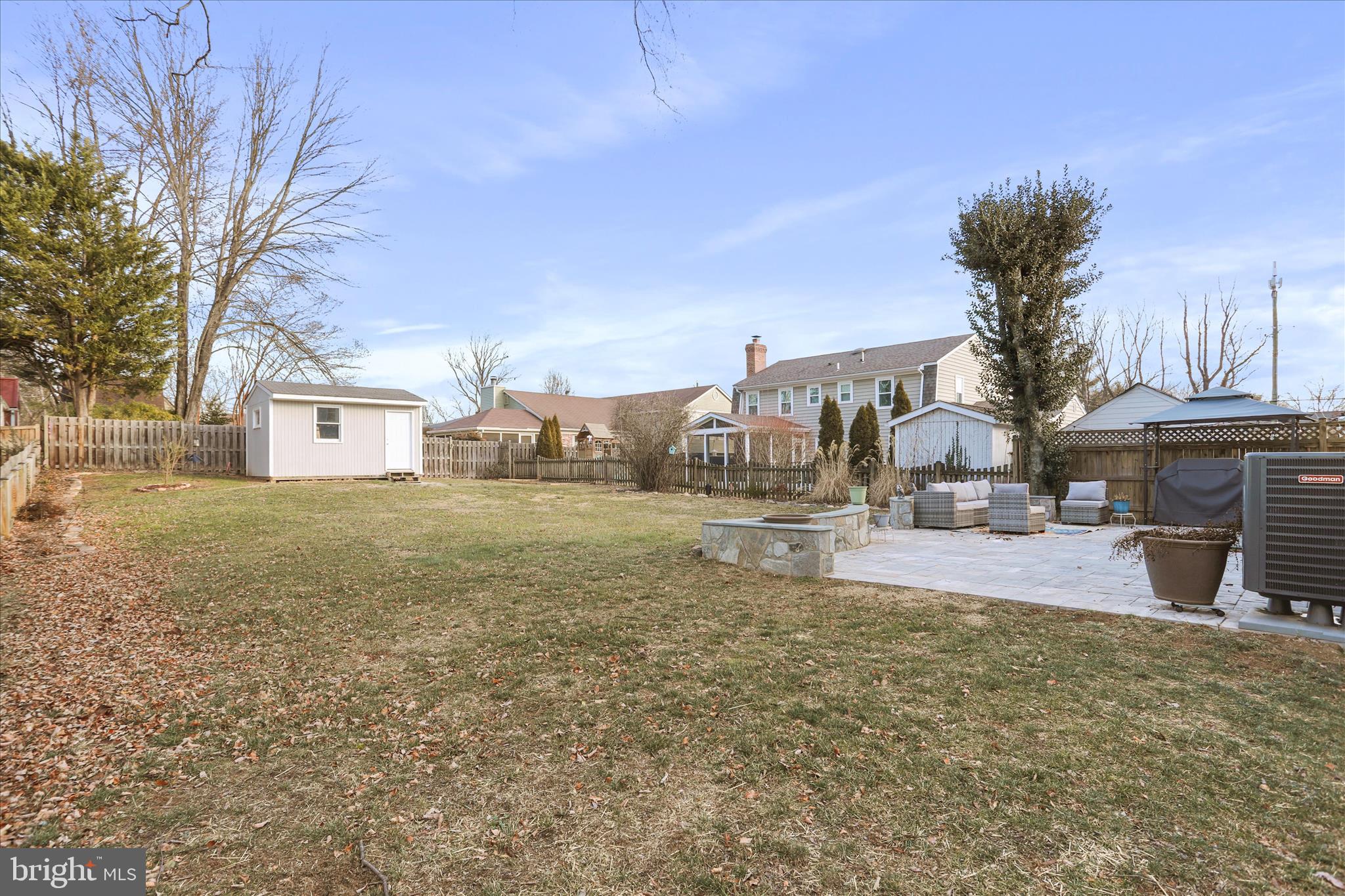 408 Blue Ridge Avenue Northeast Leesburg, VA 20176 - Photo 6 of 36 a backyard of a house with table and chairs