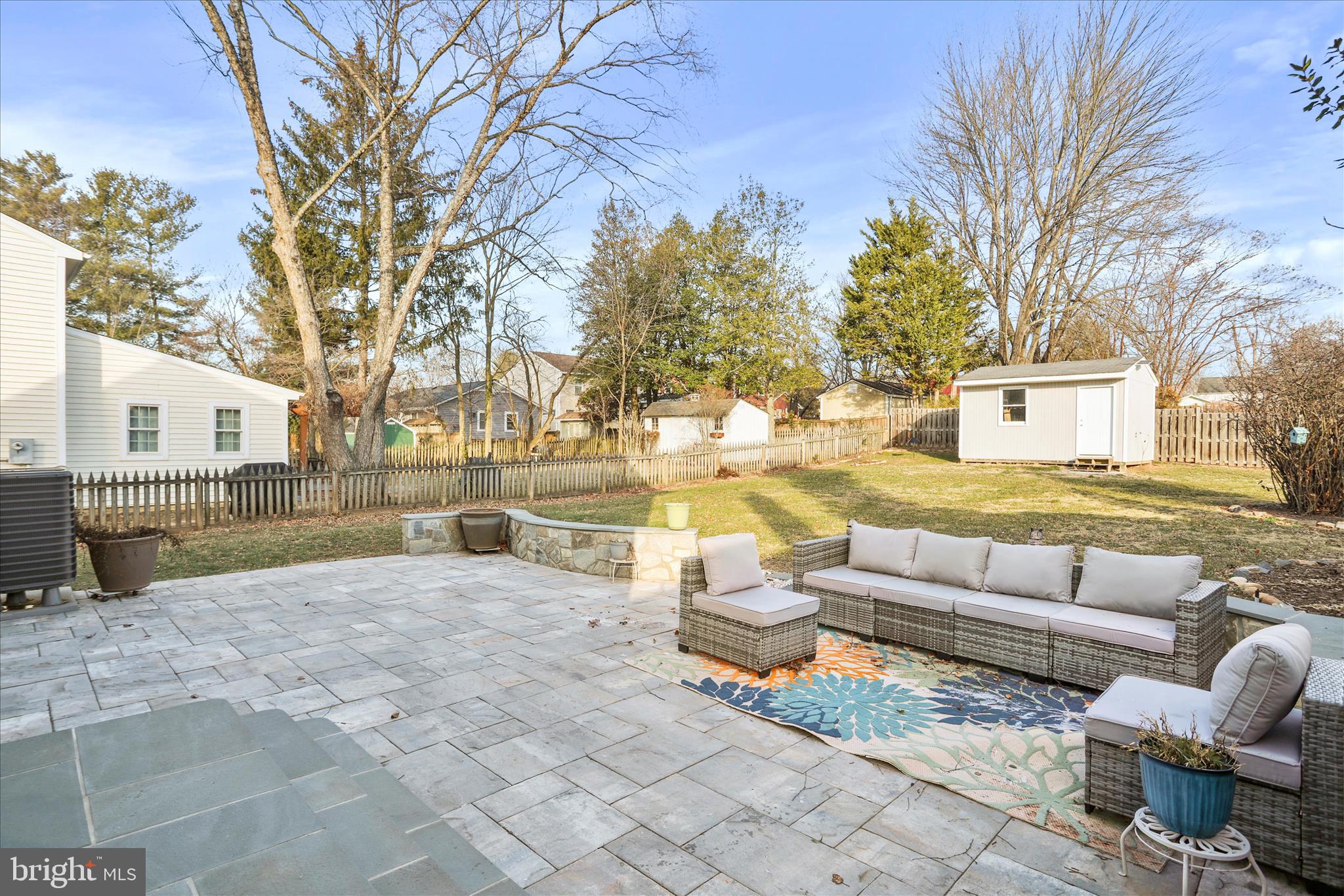 408 Blue Ridge Avenue Northeast Leesburg, VA 20176 - Photo 7 of 36 a view of a patio with couches and swimming pool with a yard