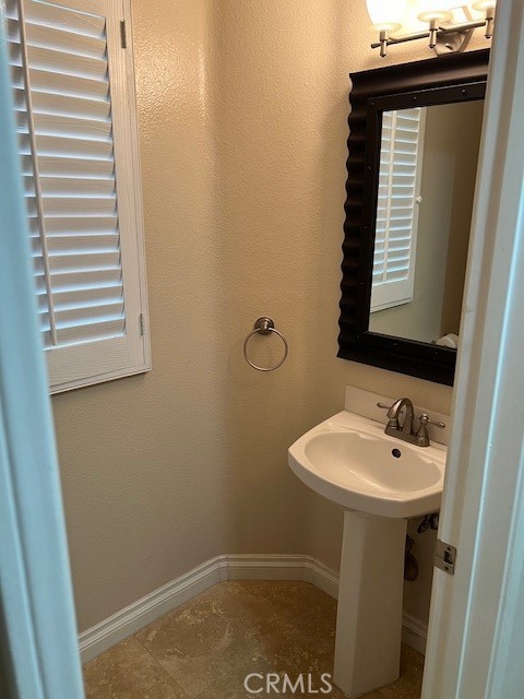 31 Chandon Laguna Niguel, CA 92677 - Photo 9 of 13 a bathroom with a sink and a window