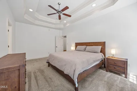 a kitchen with stainless steel appliances white cabinets a sink and a large window