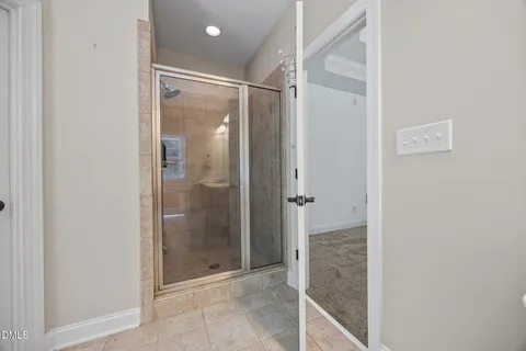 a kitchen with a refrigerator cabinets and wooden floor