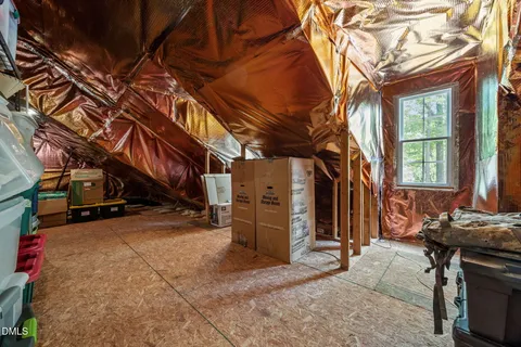 a bedroom with a bed and a ceiling fan
