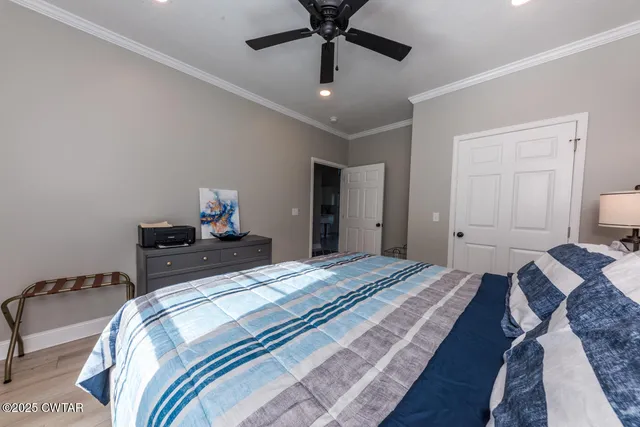 a view of room with window and a ceiling fan
