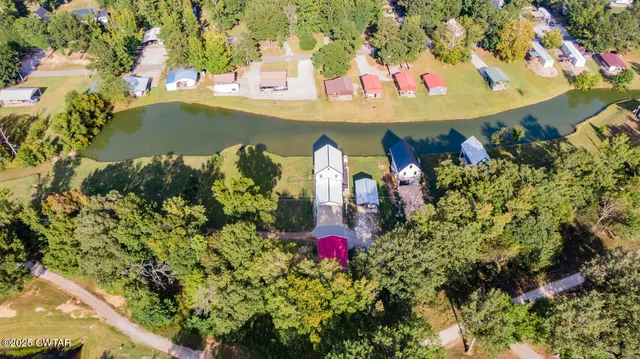 an aerial view of a house with a swimming pool