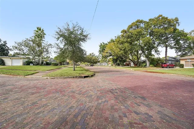 a view of outdoor space with garden and trees