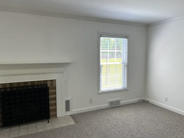 a view of a chairs and table in the balcony