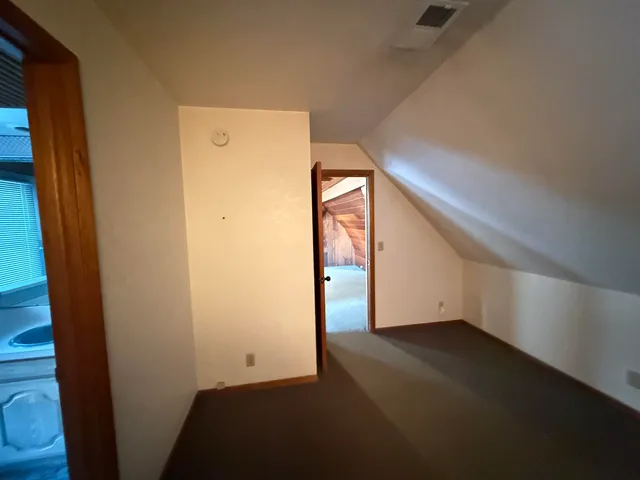 a view of a big room with windows