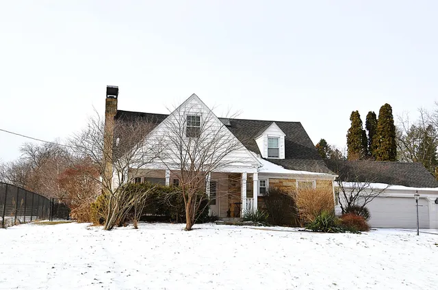 a view of an empty room with a fireplace
