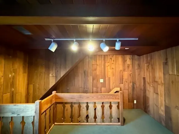 a view of a big room with windows