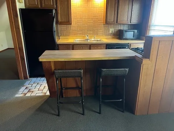 a kitchen with lots of counter top space and dining table