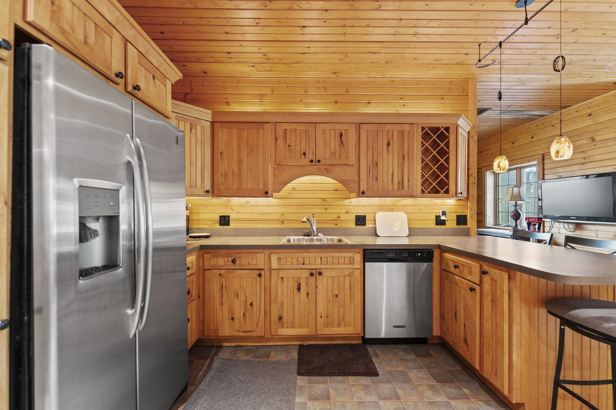 5382 Guilford Road Rockford, IL 61107 - Photo 52 of 66 a kitchen with stainless steel appliances granite countertop a sink and cabinets