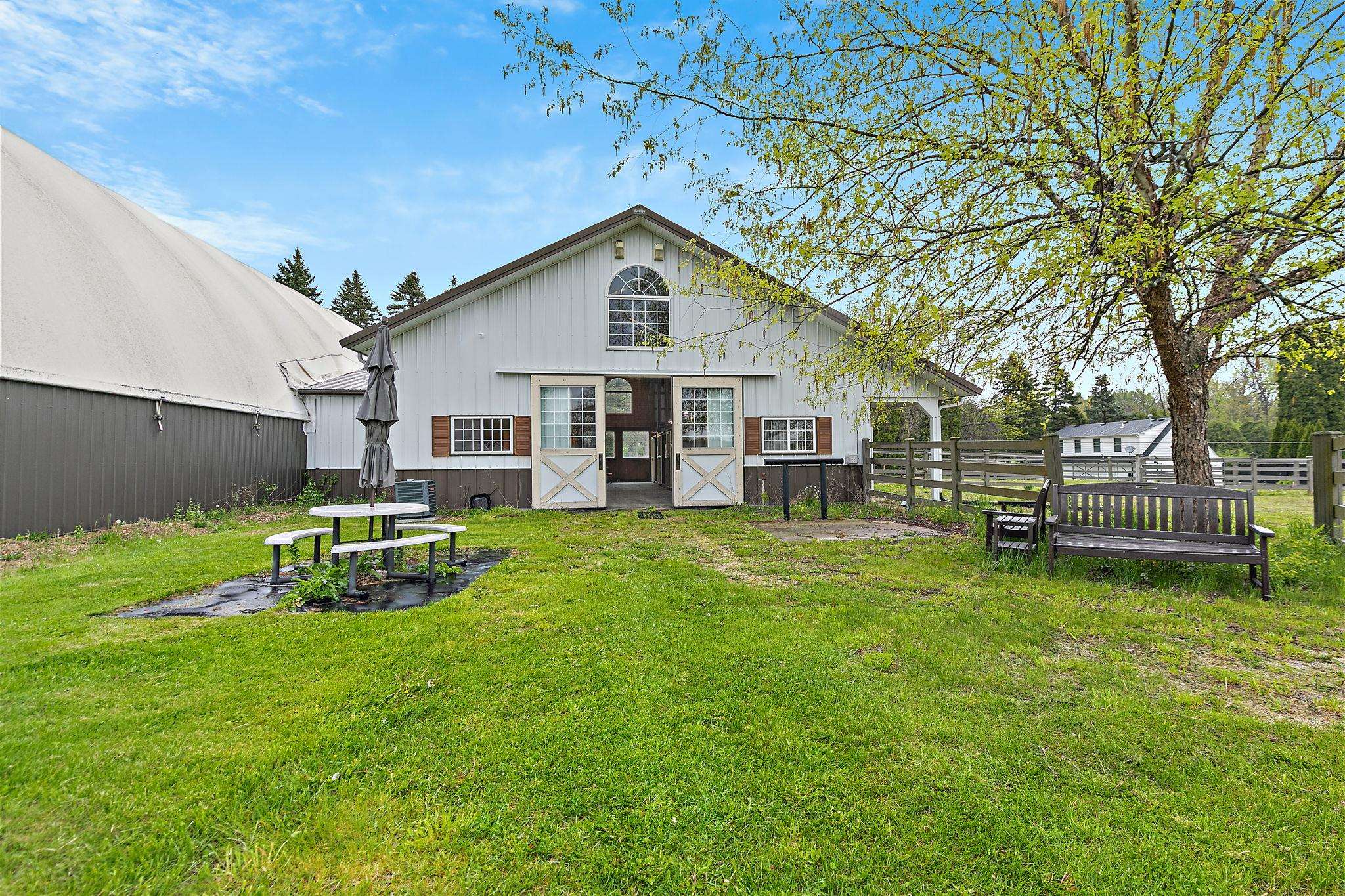 5382 Guilford Road Rockford, IL 61107 - Photo 54 of 72 a view of a house with a yard porch and sitting area