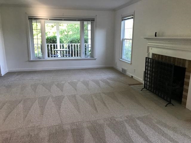 5382 Guilford Road Rockford, IL 61107 - Photo 10 of 66 a view of an empty room with a fireplace