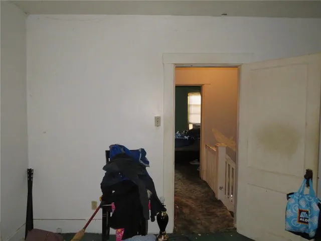a white toilet sitting next to a bath tub and shower