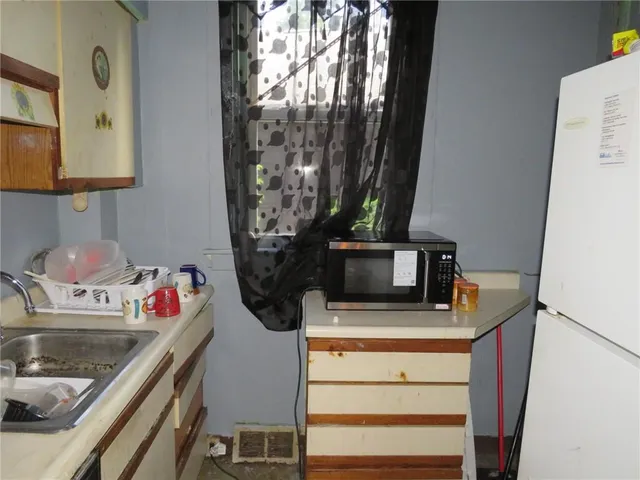 a kitchen with a stove and cabinets