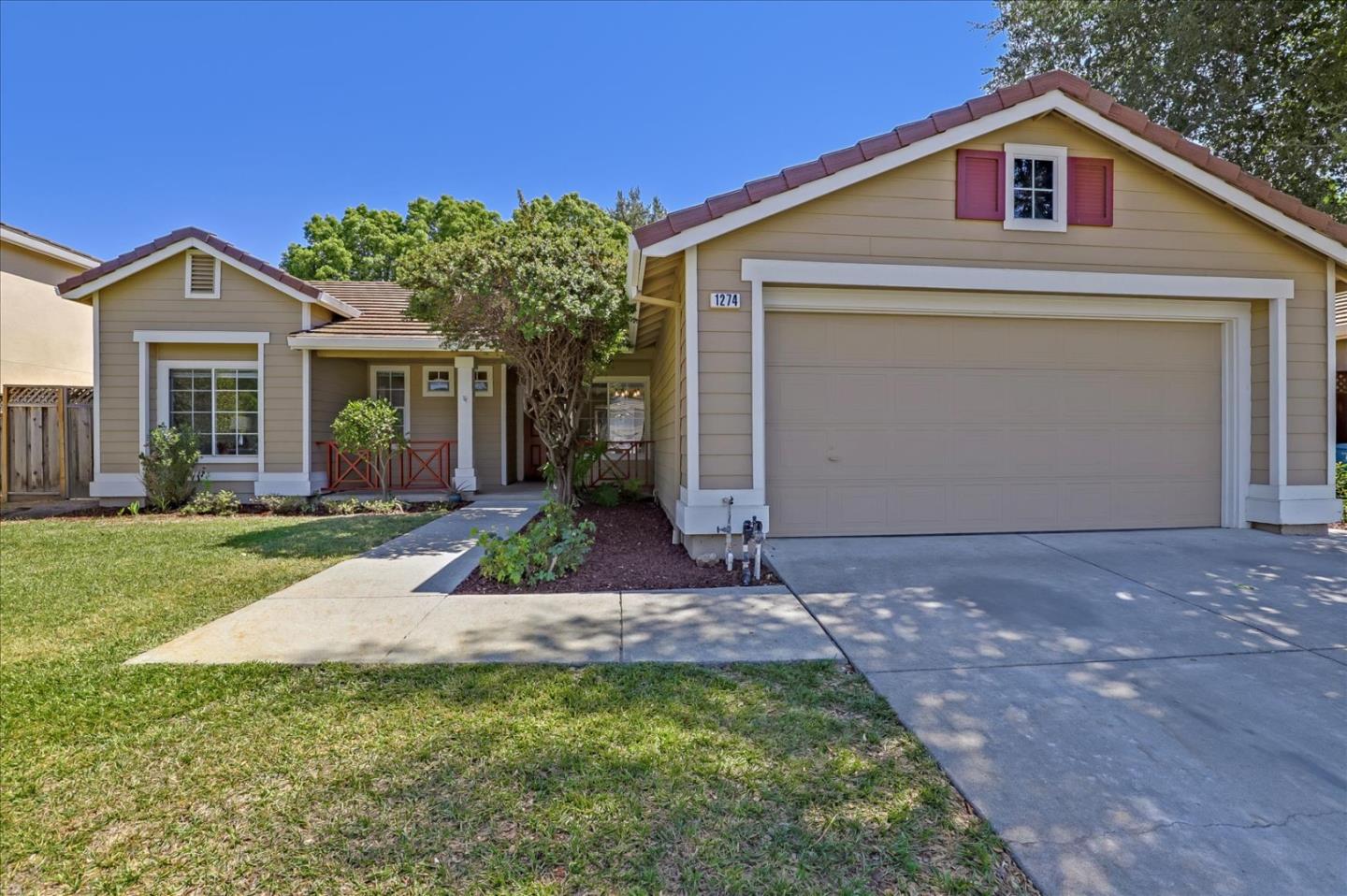 1274 Blacksmith Drive Gilroy, CA 95020 - Photo 1 of 30 a front view of a house with a yard and garage