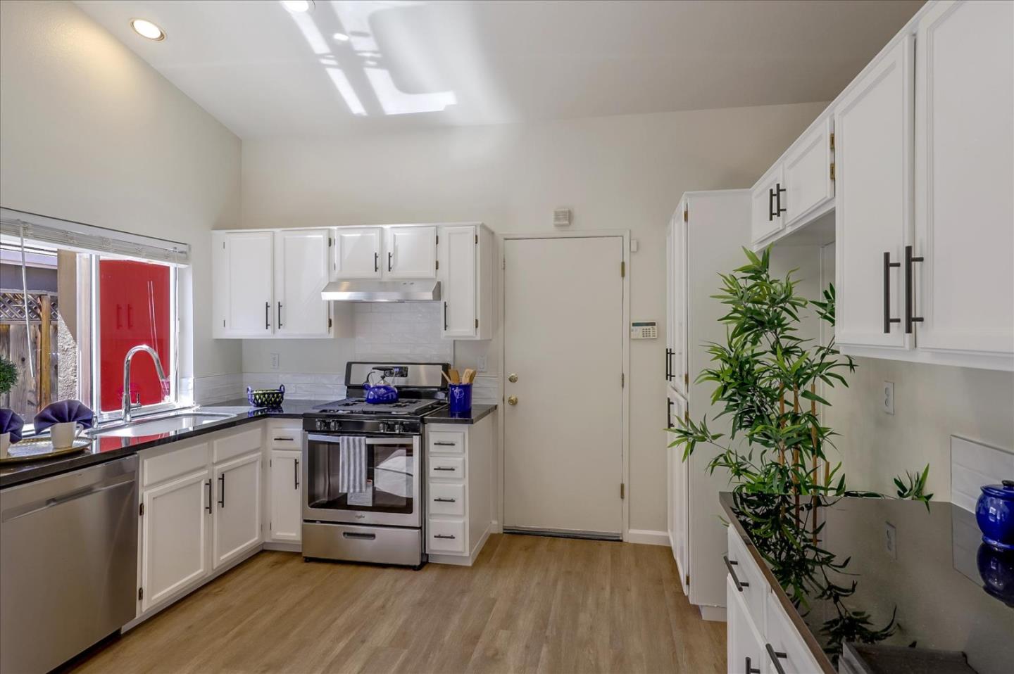 1274 Blacksmith Drive Gilroy, CA 95020 - Photo 11 of 30 a kitchen with stainless steel appliances a white cabinets stove and refrigerator