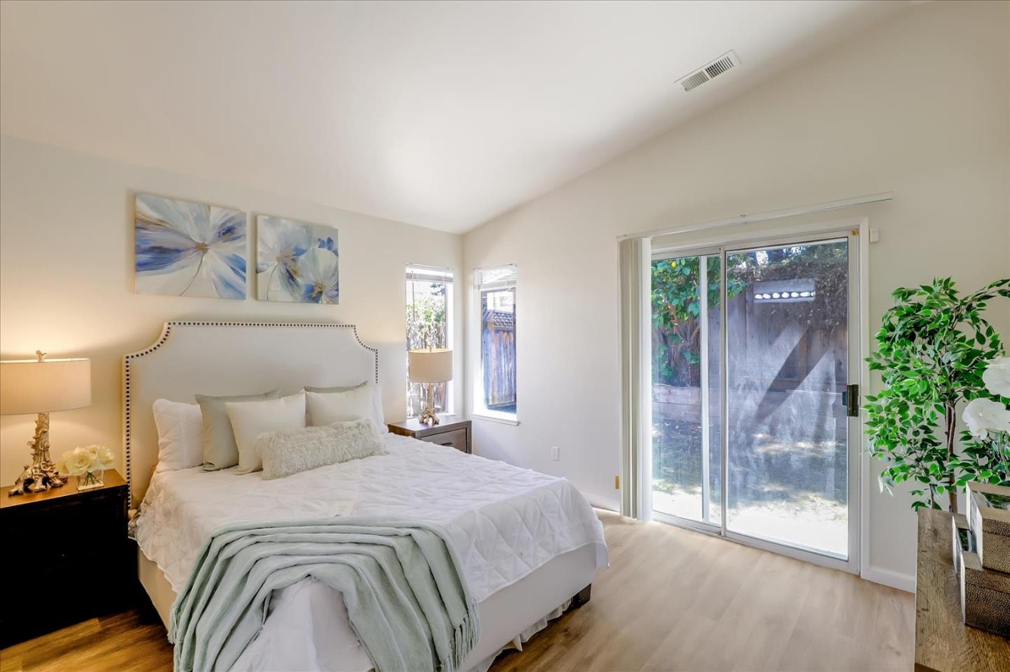 1274 Blacksmith Drive Gilroy, CA 95020 - Photo 17 of 30 a bedroom with a large bed and a potted plant