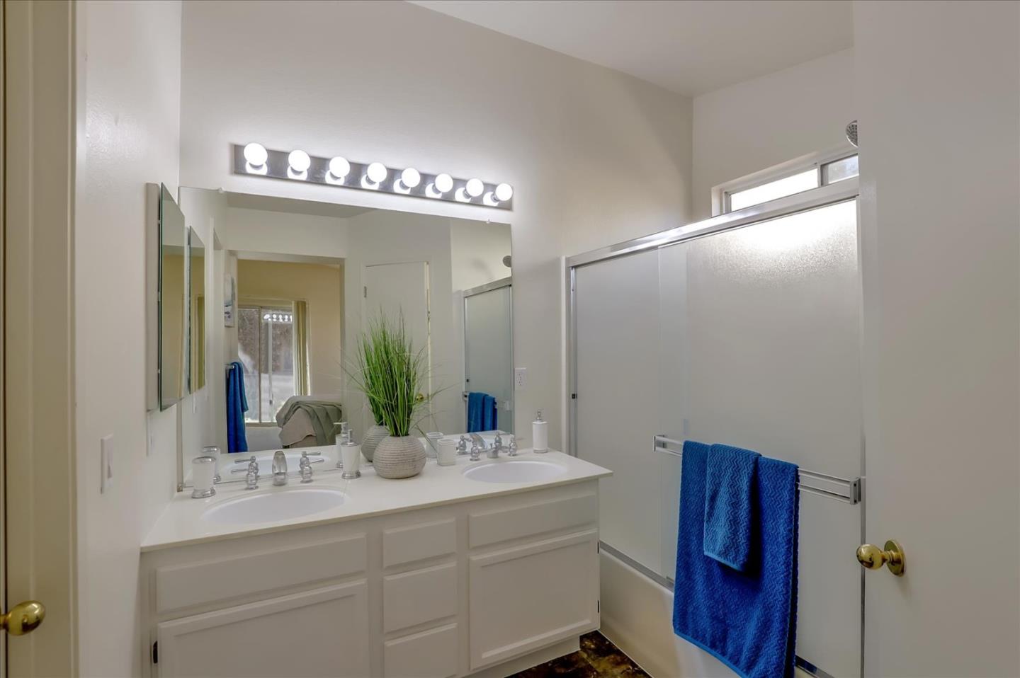 1274 Blacksmith Drive Gilroy, CA 95020 - Photo 21 of 30 a bathroom with a double vanity sink and a mirror