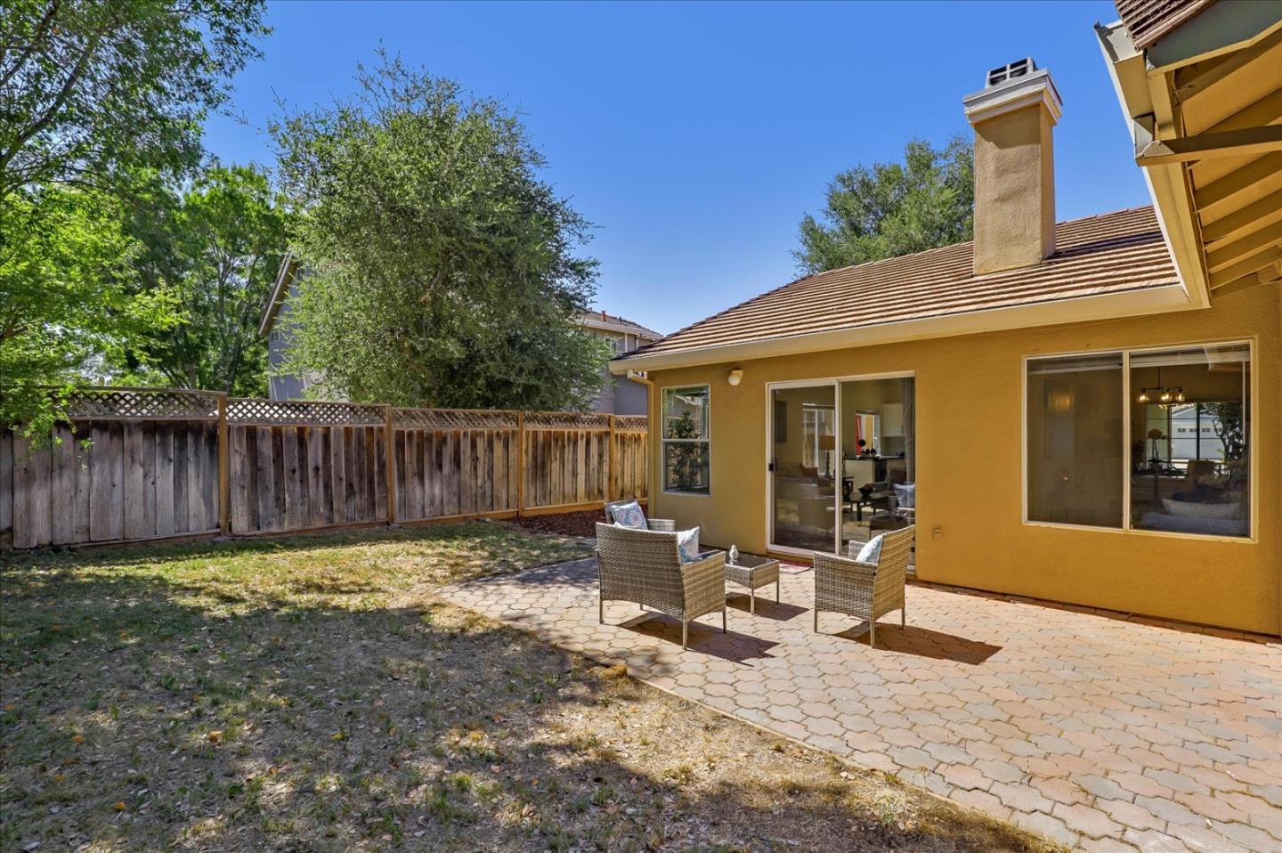 1274 Blacksmith Drive Gilroy, CA 95020 - Photo 27 of 30 a view of a chair and table in backyard of the house