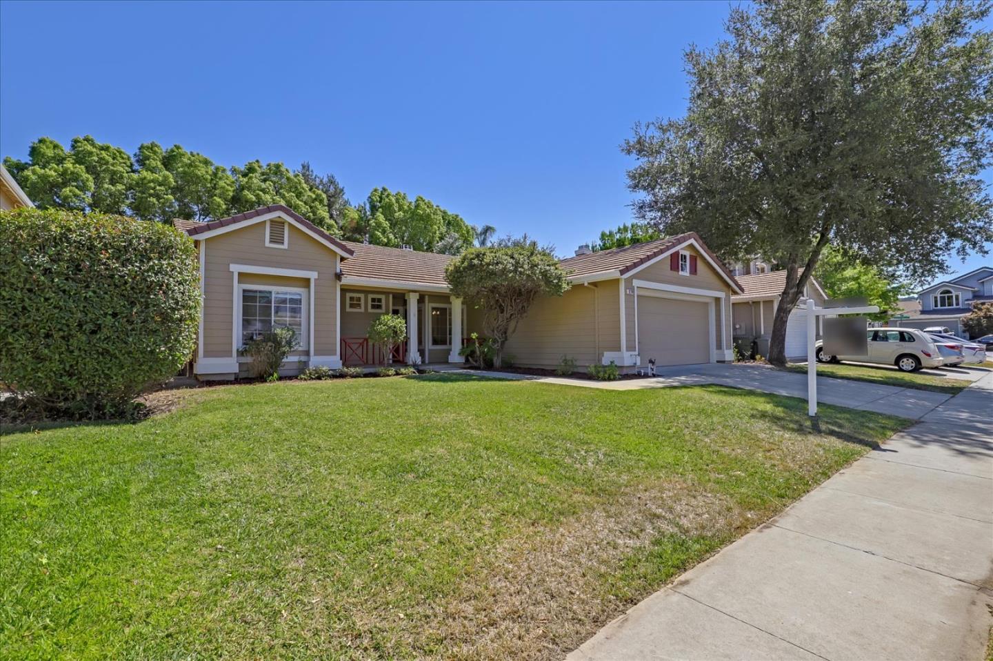 1274 Blacksmith Drive Gilroy, CA 95020 - Photo 3 of 30 a front view of a house with a garden