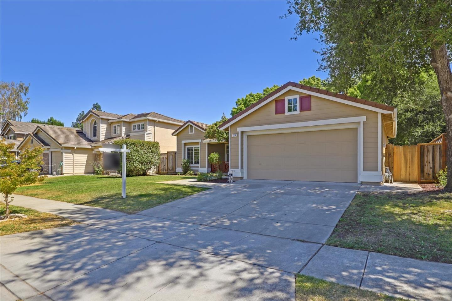 1274 Blacksmith Drive Gilroy, CA 95020 - Photo 4 of 30 a front view of a house with a yard and garage