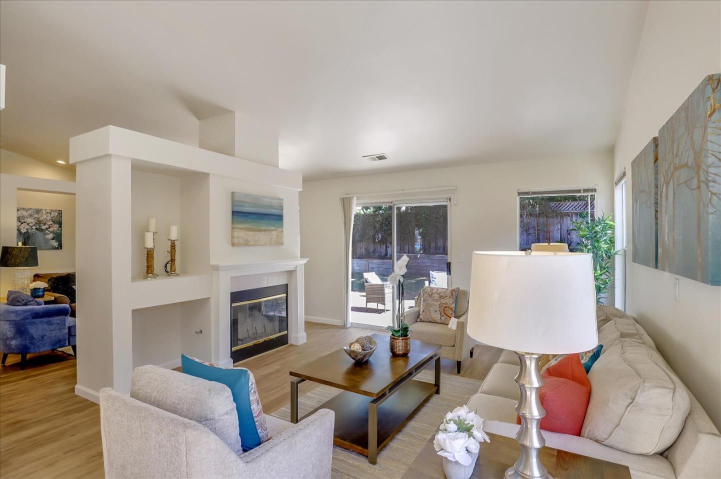 1274 Blacksmith Drive Gilroy, CA 95020 - Photo 10 of 30 a living room with furniture a fireplace and a flat screen tv