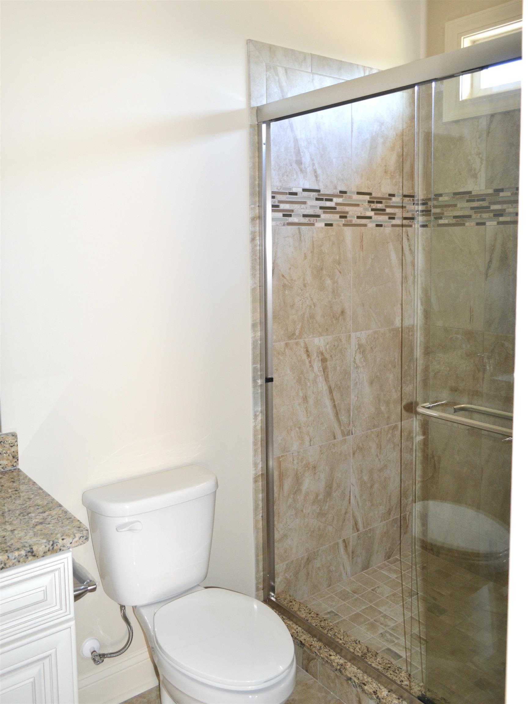 108 Hallandale Lane, Unit RIGHT Murrells Inlet, SC 29576 - Photo 17 of 35 Bathroom featuring vanity, a shower with shower door, and toilet